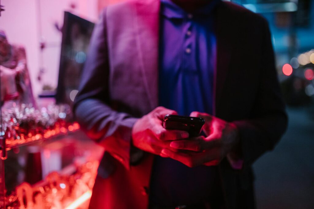 A user's hand pointing at a glowing, futuristic user interface, illustrating the simplicity of intent-based systems.