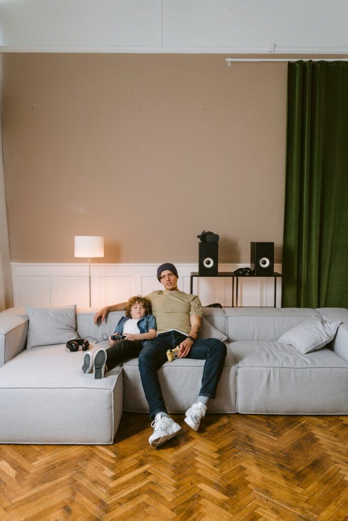 A gamer focused on their screen, with neon lights reflecting, symbolizing a play-to-earn scholar.