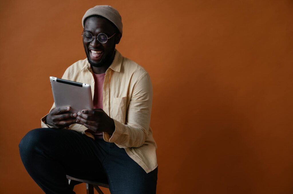 A professional signing a digital contract on a tablet, with an abstract blockchain graphic in the background signifying digital asset ownership.