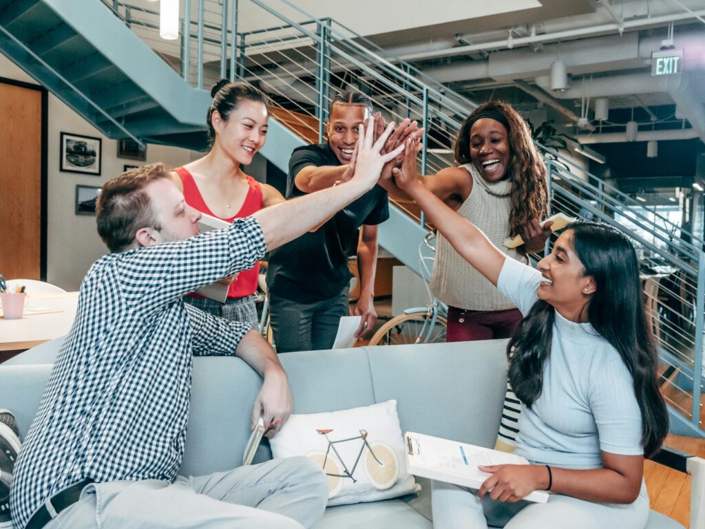 A photo of a team of diverse developers collaborating around a whiteboard, representing the core team behind a blockchain project.