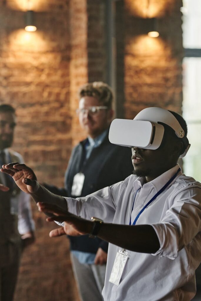 A team of diverse professionals in a modern office brainstorming and pointing at data visualizations on a large interactive screen.