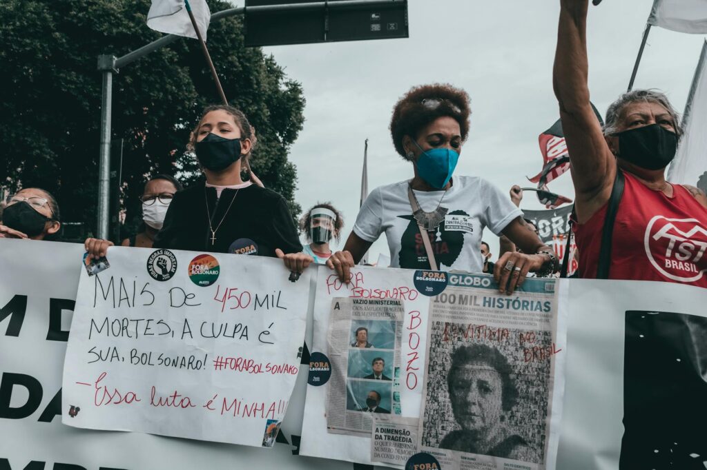 A diverse group of protesters wearing anonymous masks, symbolizing digital freedom and dissent.