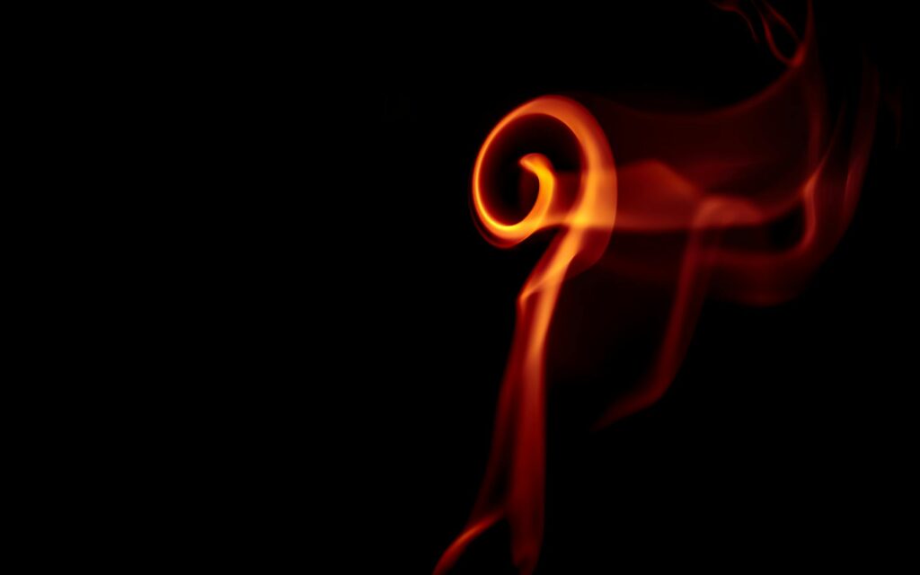 An artistic representation of a physical Bitcoin coin glowing ominously, symbolizing market volatility.